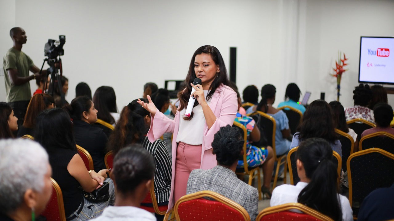 Photo of Anuskha Sonai, President of Creative Tech hub Caribbean speaking to attendees of the Women in ICT Summit